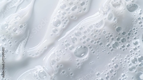 A detailed close up of white liquid with bubbles. Ideal for science or healthcare projects © Fotograf