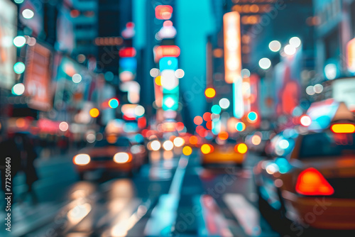A blurry city street with cars and a neon sign photo
