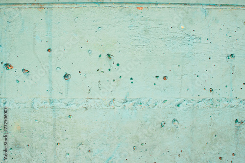 Imagen horizontal de una pared de hormigón color azul con desgaste y textura vieja 