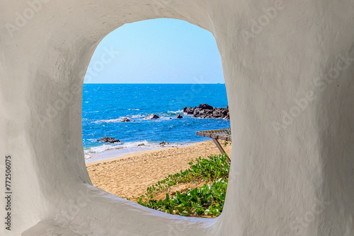 Beach at World's End Park, Sanya, China. View of the beautiful beach and sea from the white bungalow photo