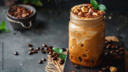 Iced coffee with almond milk in a glass jar