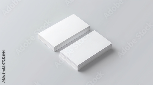two white business cards on a gray background