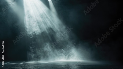 Ray of scenic spot light over black smoky background, square stage illumination background photo