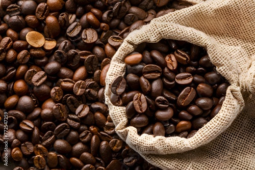 Roasted coffee bean placed on a linen sack, highlighting freshness