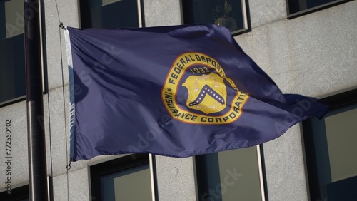 Flags in front of Federal Deposit Insurance Corporation building in Washington, DC.