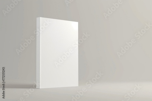 A pristine white box rests atop a smooth white floor, creating a simple yet striking visual contrast