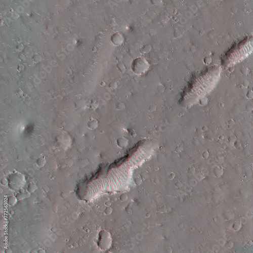 Mars in 3D. Pits and Troughs in Utopia Planitia. Anaglyph image. Use red/cyan 3d glasses.
Image from the Mars Reconnaissance Orbiter. NASA/JPL/University of Arizona.