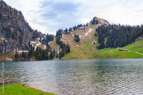 View of the Lake Hinterstocken at the foot of Stockhorn peak in Bernese Oberland, Switzerland photo