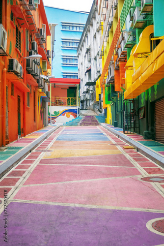 Bright colored backstreet with walls painted in graffiti style. Modern urban environment © Svetlana Radayeva