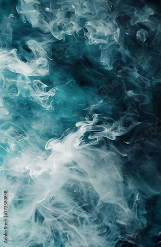 Smokey abstract background with blue, grey, white and black wisps of smoke swirling and mixing. © Janice