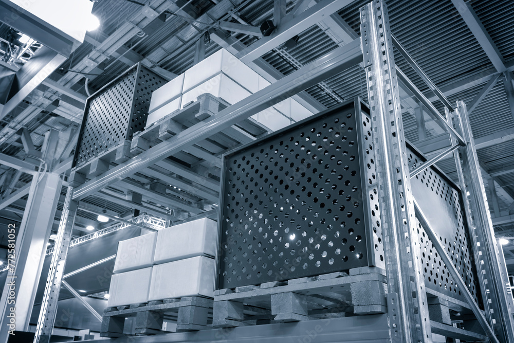 Fototapeta premium modern distribution warehouse with boxes on racks