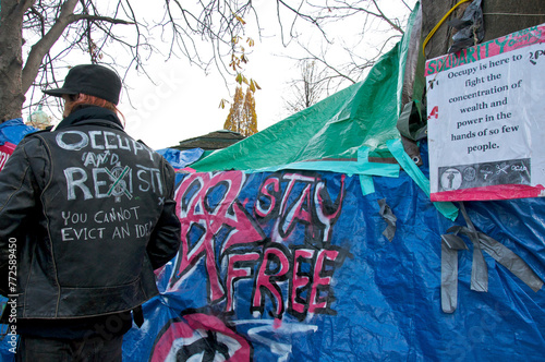 Homeless people resist the eviction to remove the tent city in the public park photo