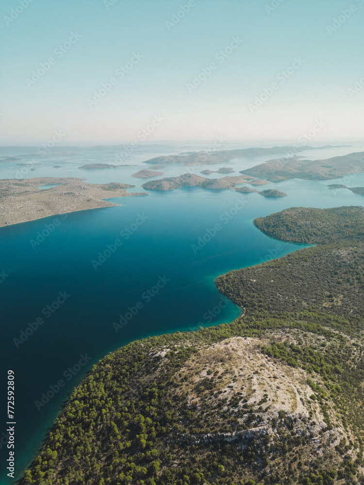 Drone view of blue sea and group of picturesque islands with mountains in Telascica National Park, Croatia