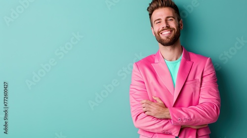 Male model wearing a pink suit isolated on solid background photo