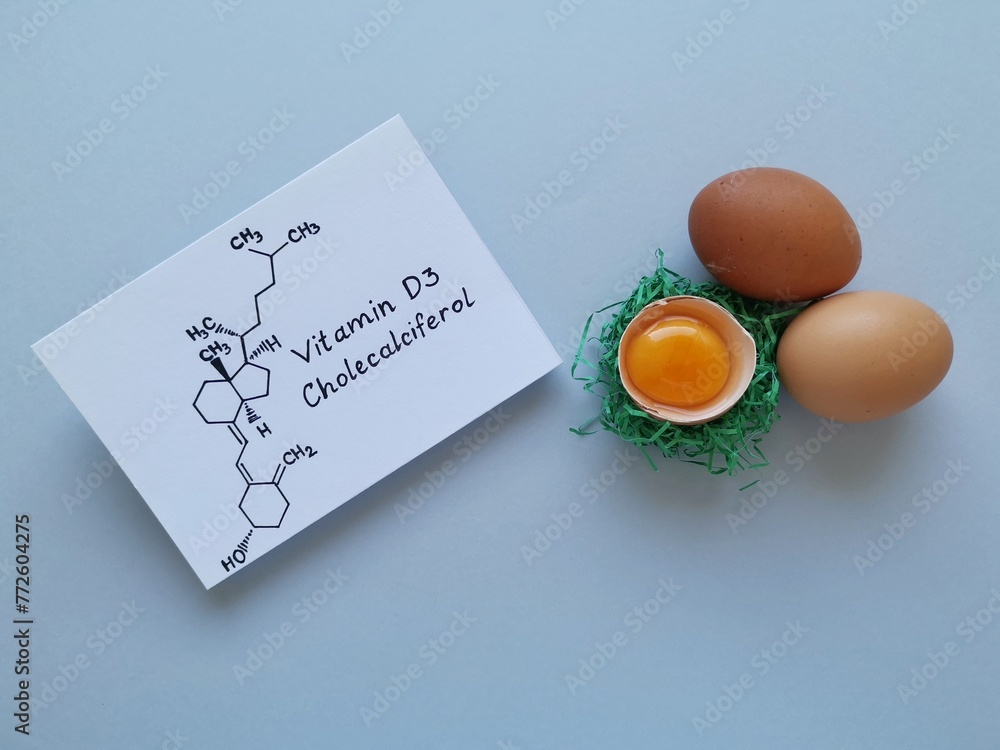 Structural chemical formula of vitamin D with fresh eggs. Egg yolk, a ...