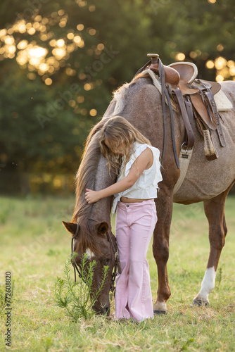 Little Girl with Roan Horse in  western quarter horse hugging love bind photo