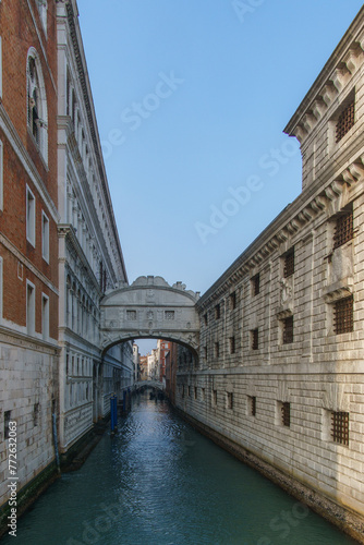Small canal passing towards famous Bridge of Sighs or Ponte dei Sospiri, Venice, Veneto, Italy