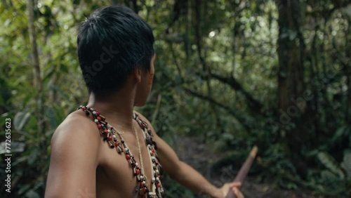 Huaoranis young Man using a Blowgun