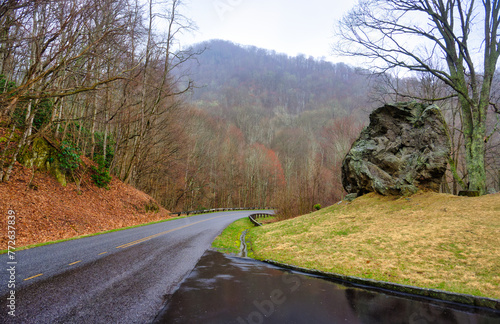 A landscape of a large boulder by a curved road in the mountains on the famous Blue Ridge Parkway in North Carolina © Mark Alan Howard