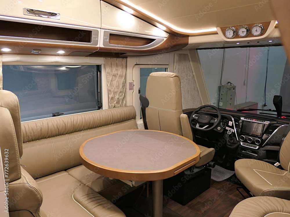 Dining table, rear, front seats and overhead lockers in modern ...