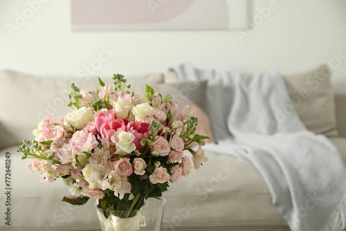 Beautiful bouquet of fresh flowers in vase indoors, space for text © New Africa