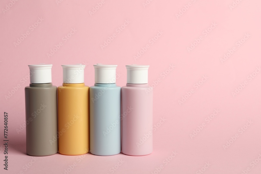 Cosmetic travel on pink background. Space for text Cosmetic travel on pink background. Space for text