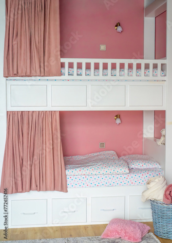 Fototapeta Naklejka Na Ścianę i Meble -  Pink curtains for bunk bed for girls in the bedroom without people