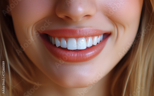 close up of a woman smiling and showing her perfect teeth. Concept for oral care  dentistry  and stomatology. 