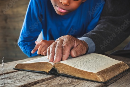 Grandfather reading bible stories to grandson