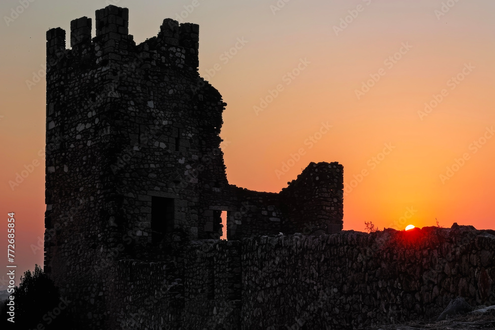 Stunning Visuals: The Fusion of an Ancient Castle's Silhouette Against a Sunset