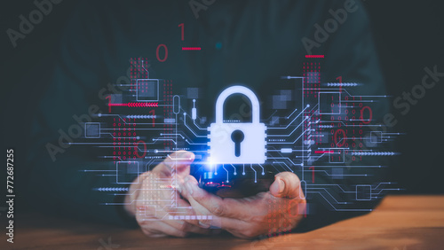Business leader actively safeguarding personal data on smartphone via virtual screen interfaces to enhance cyber resilience. Cybersecurity and privacy concept to protect data. © ParinPIX
