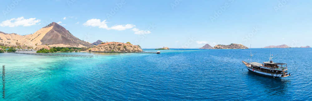 Panorama view of beaches and tourist boat sailing in Flores Island, Indonesia Panorama view of beaches and tourist boat sailing in Flores Island, Indonesia