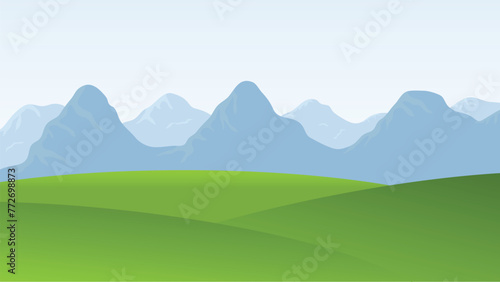 landscape scene. green field and mountain background