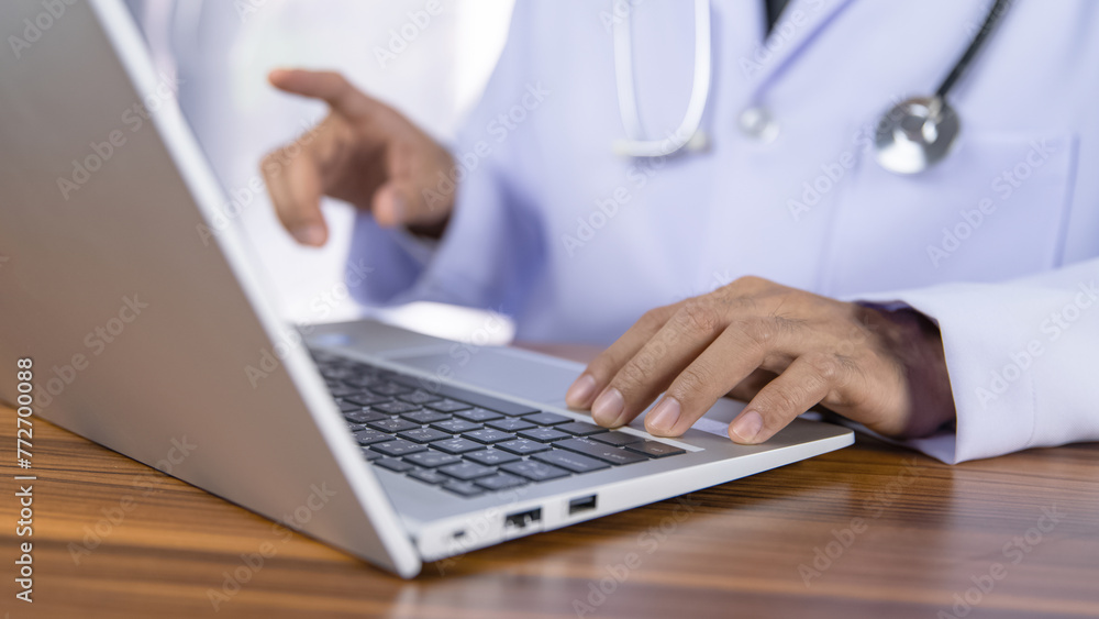 Fototapeta premium Doctors use computers to record treatment data into the hospital's data storage system using modern technology.