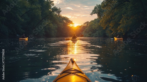 A family enjoying a leisurely kayak trip down a gentle river photo