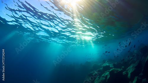 Sun s rays penetrate in clear blue underwater scene