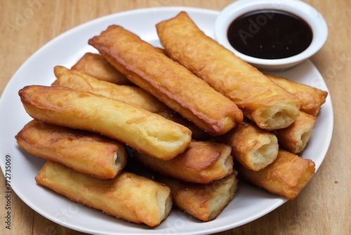 Youtiao These are deep-fried dough sticks often eaten for breakfast or as a snack, sometimes paired with soy milk 