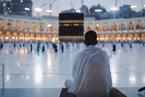 man praying in Mecca during Hajj and Umrah