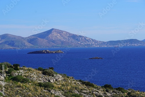 View of the rocky coastline of Attica and islands near the town of Varkiza, in Athens, Greece