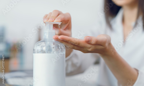 Hand using alcohol wash gel for cleaning sanitizer.