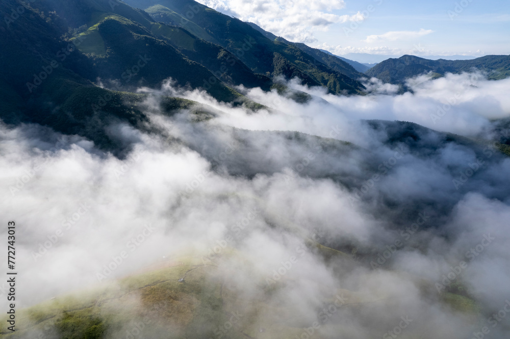 Landscape of Morning Mist with Mountain Layer at north of Thailand. mountain ridge and clouds in rural jungle bush fores