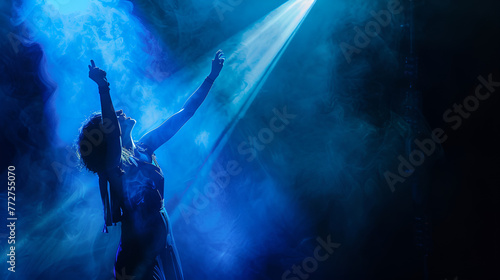 Graceful singer with uplifted arm bathed in serene blue