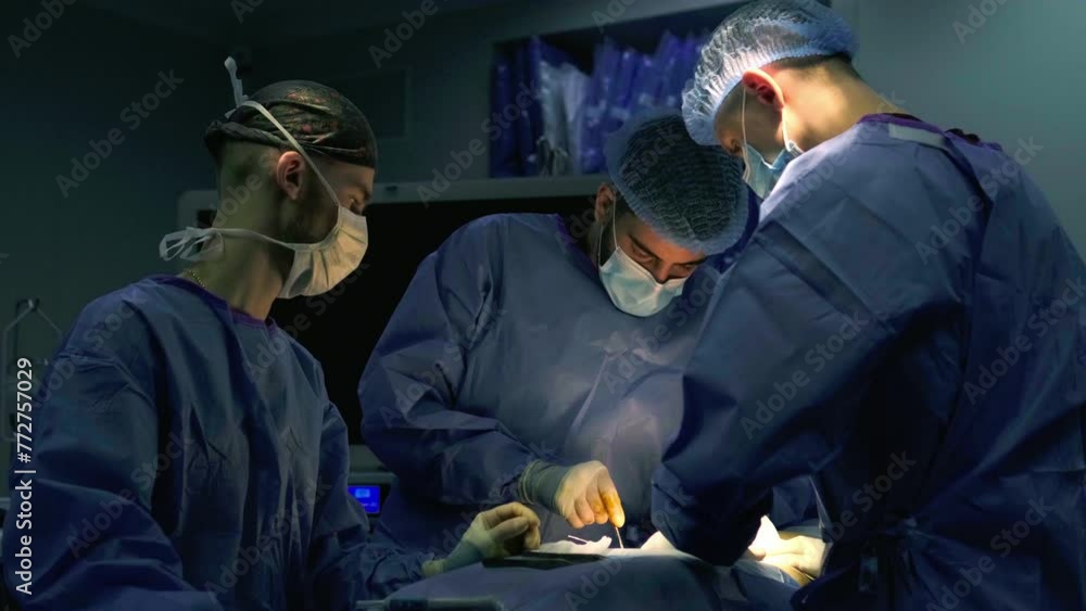 Close-up of surgeons in medical uniforms during an operation. Surgical office, cosmetic surgery. Healthcare concept. Close-up of surgeons in medical uniforms during an operation. Surgical office, cosmetic surgery. Healthcare concept.