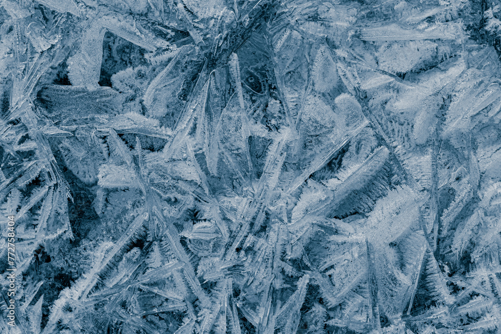 Hoary frost ice texture. Crystals in blue tone background. Cold frosty surface of ice. Hoary frost ice texture. Crystals in blue tone background. Cold frosty surface of ice.