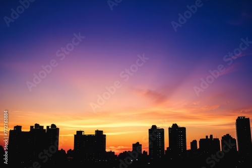 An empty urban skyline at sunset  with buildings silhouetted against the colorful hues of the evening sky  as the last rays of sunlight fade away on the horizon  Generative AI
