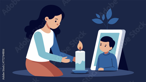 A child lighting a candle and placing it by a photo of a deceased loved one demonstrating how religious practices can provide solace and