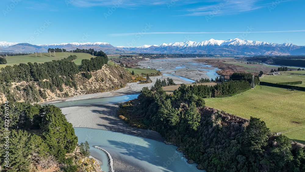 Aerial scenery of the agricultural fields and farm land around the Waimakariri Gorge .