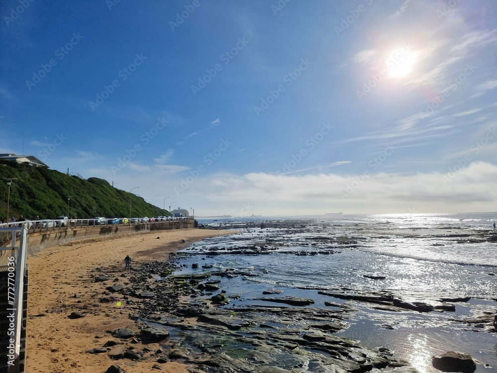 Fototapeta premium Looking over the Cowrie Hole from Newcastle Baths New South Wales, Australia early in the morning at low tide