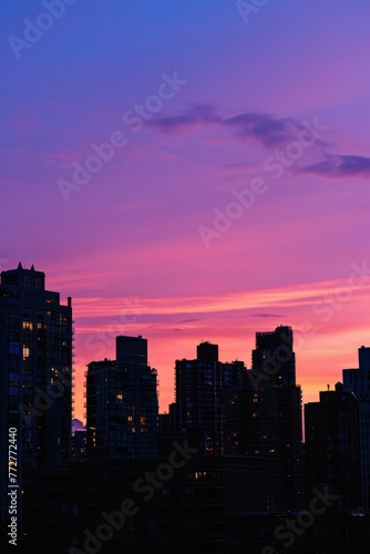 An empty urban skyline at sunset, with buildings silhouetted against the colorful hues of the evening sky, as the last rays of sunlight fade away on the horizon, Generative AI
