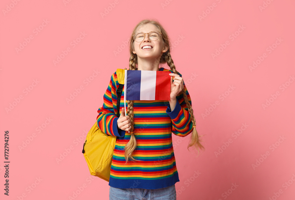 Female student with French flag on pink background Female student with French flag on pink background